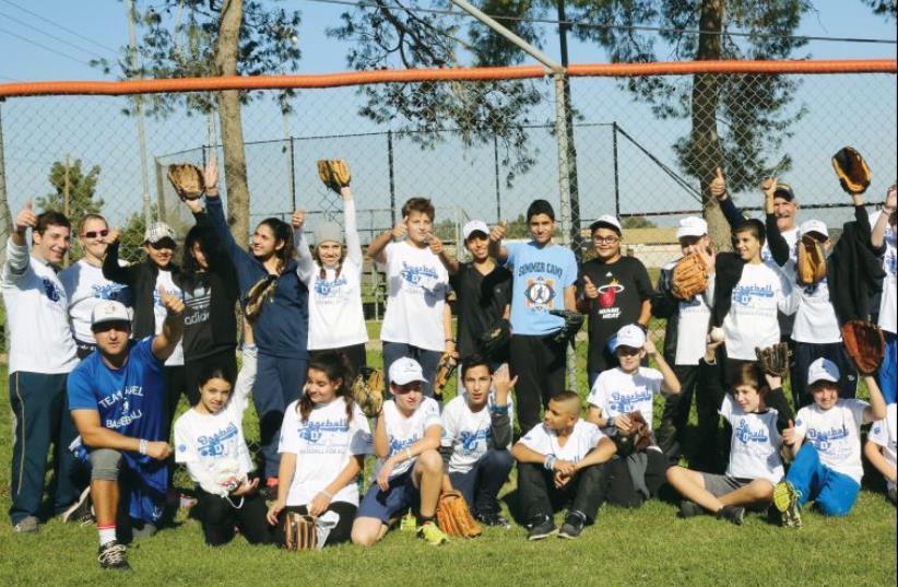THE BASEBALL LE’KULAM program brings together Arab and Jewish youths who learn to play baseball thanks to the organizers, Play Global, Israel Association of Baseball and JNF. (photo credit: YOSSI ZAMIR)