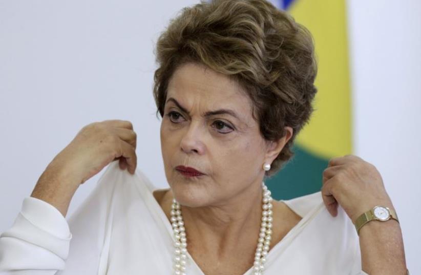 Brazil's President Dilma Rousseff attends a ceremony for regulating the Green Free Trade Zone in some cities of the Amazon, at Planalto Palace in Brasilia (photo credit: REUTERS)