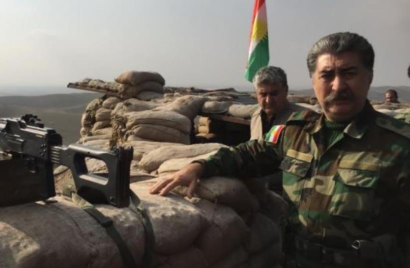 Hussein Yazdanpana, vice-president of the Kurdistan Freedom Party, speaking at the frontline with ISIS northeast of Kirkuk (photo credit: SETH J. FRANTZMAN)