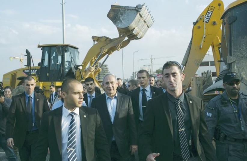PRIME MINISTER Benjamin Netanyahu is shown on a visit to Harish, a new Israeli city under construction (photo credit: REUTERS)
