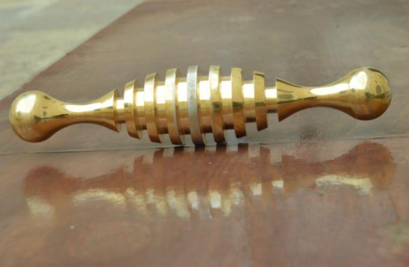 Ancient 8.5 kilo gold tool discovered in Jerusalem cemetery ‏ (photo credit: Israel Antiquities Authority)