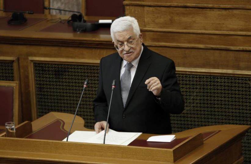 Palestinian President Mahmoud Abbas delivers a speech at the Greek parliament in Athens, Greece December 22, 2015 (photo credit: REUTERS)