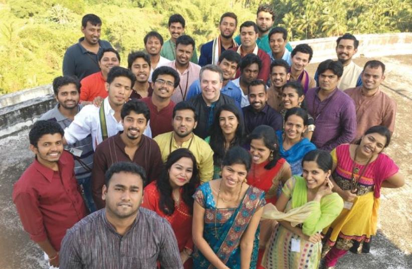 JASON FOODMAN (middle), the CEO of Global Delight Technologies, stands with his R&D team in India (photo credit: Courtesy)