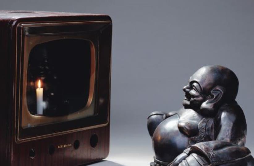 ‘Smiling Buddha (Buddha Looking at Old Candle TV),’ 1992, by Korean-American artist Nam June Paik (photo credit: Courtesy)