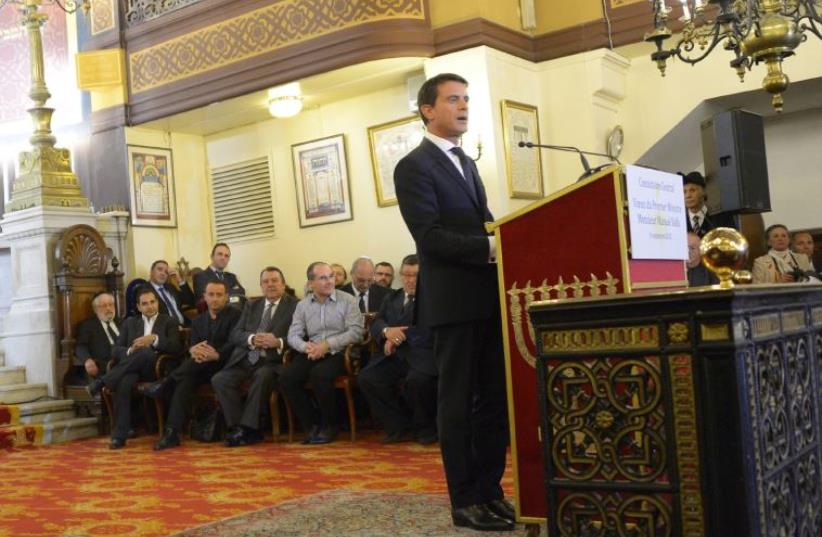 French Prime Minister Manuel Valls delivers a speech at the Nazareth synagogue in Paris ahead of Rosh Hashanah in September (photo credit: BERTRAND GUAY / AFP)