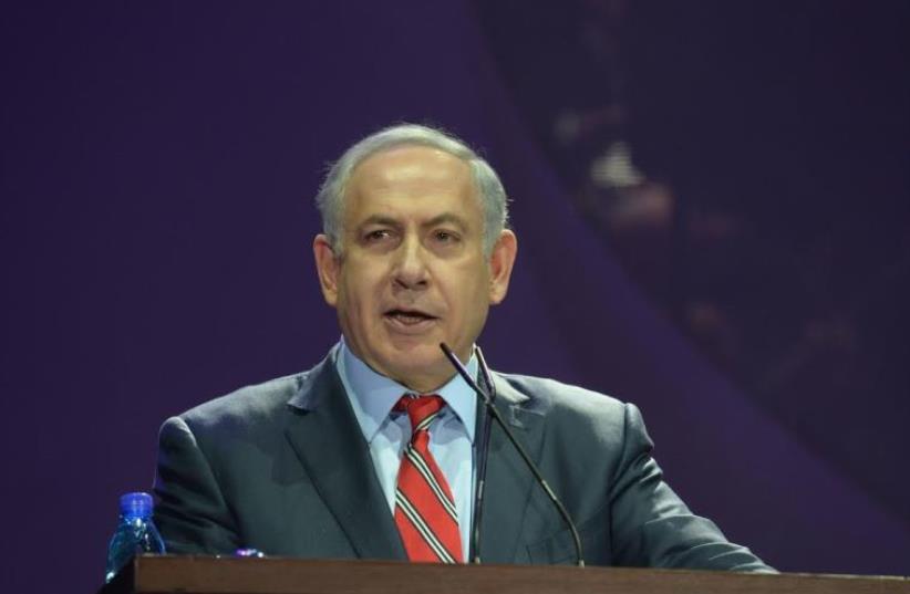 Prime Minister Benjamin Netanyahu speaks at a Jerusalem event marking 25 years to the beginning of the massive wave of immigration from the former Soviet Union (photo credit: AMOS BEN-GERSHOM/GPO)