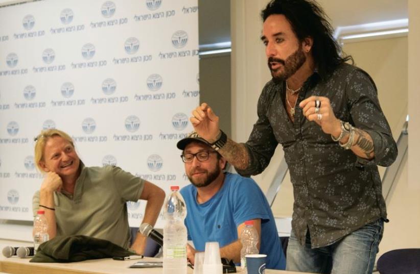 Marco Mendoza of Dead Daisies (right) with (from right) Jeremy Hulsh of Oleh! Records and David Edwards, former manager of INXS and co-founder of Dead Daisies (photo credit: MOSHE CHITAYAT/COURTESY EYAL BROOK – LAW OFFICE)
