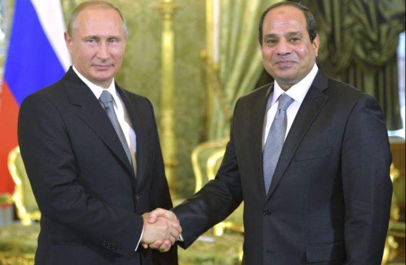 Russian President Vladimir Putin (L) shakes hands with his Egyptian counterpart Abdel Fattah al-Sisi during their meeting in Moscow, August 26, 2015 (photo credit: REUTERS)