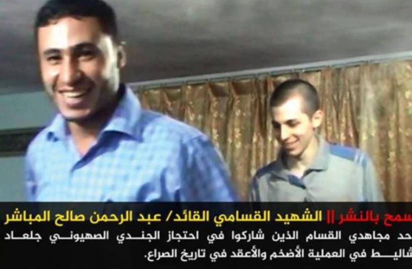 Hamas photo of Gilad Schalit with one of his captors, Abdel Rahman al-Mubasher, who died in a tunnel collapse.  (photo credit: ARAB MEDIA)