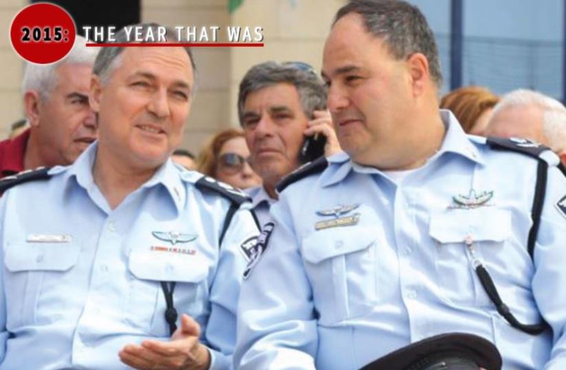 Asst.-Ch. Bentzi Sau (right) sits with former police chief Yohanan Danino at a ceremony (photo credit: JPOST STAFF,BEN HARTMAN)