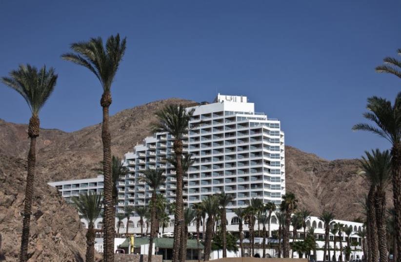 A hotel is seen against a backdrop of mountains in the Red Sea resort of Eilat [Illustrative] (photo credit: REUTERS)