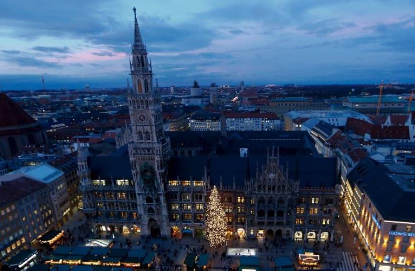 A view shows Munich's illuminated townhall and the Christmas market after the official lighting of the Christmas tree (photo credit: REUTERS)