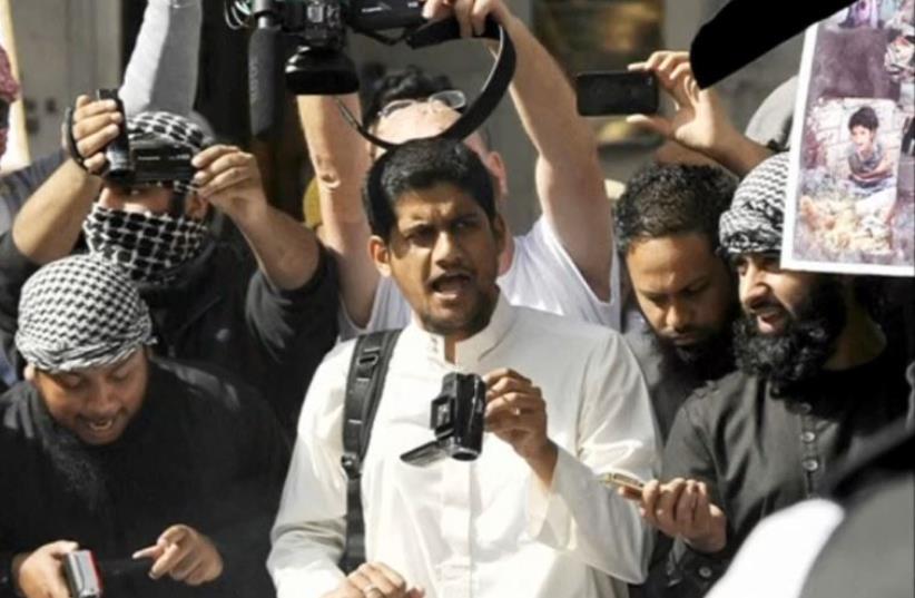 A file photograph shows a man identified by British media as Siddharta Dhar taking part in a demonstration outside the US embassy in London (photo credit: SCREENSHOT/REUTERS)