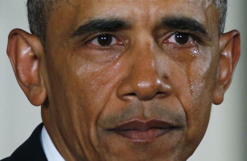 US President Barack Obama sheds a tear while delivering a statement on steps the administration is taking to reduce gun violence in the East Room of the White House (photo credit: REUTERS)
