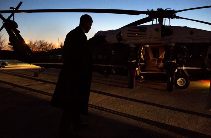 President Barack Obama boards Marine One at the Hope landing zone for departure en route to Chicago O'Hare International Airport (photo credit: OFFICIAL WHITE HOUSE PHOTO / PETE SOUZA)