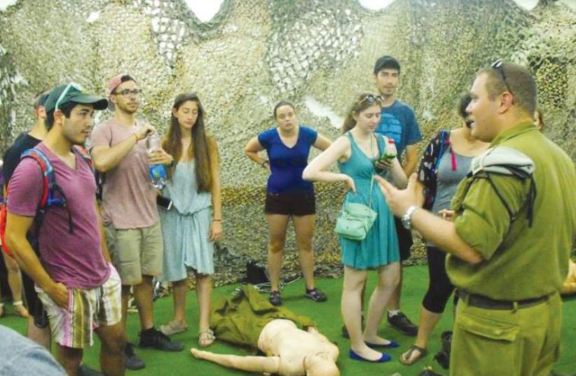 MEDICAL BIRTHRIGHT: Israel participants attend a presentation of battlefield first aid.  (photo credit: Courtesy)