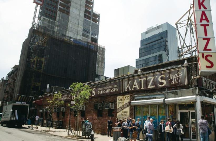 People stand in line at Katz’s Delicatessen on New York’s Lower East Side in 2014 (photo credit: REUTERS)