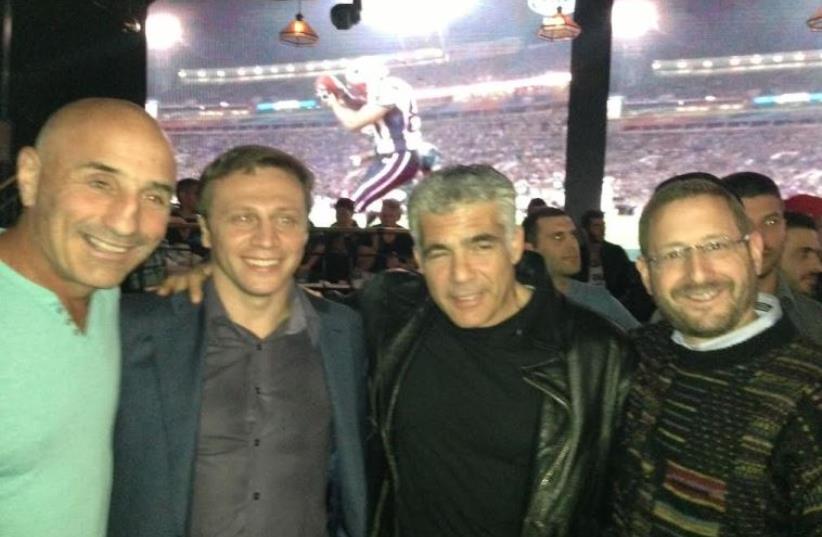 Lapid with Yesh Atid lawmakers at 2015 Super Bowl party (photo credit: YESH ATID)