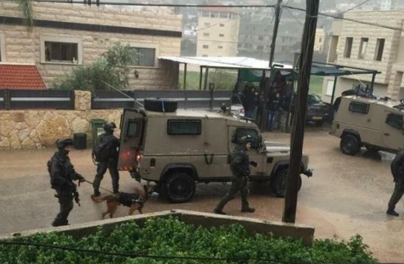 Security forces search for Nashat Milhem in the Israeli Arab village of Arara (photo credit: Courtesy)