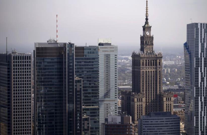 A general view of the cityscape, with the Palace of Culture and Science (2nd R), is pictured from the construction site of a new skyscraper in Warsaw, Poland October 2, 2015.  (photo credit: REUTERS)