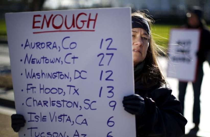 Gun control activists rally in front of the White House in Washington, January 4, 2016.  (photo credit: REUTERS)