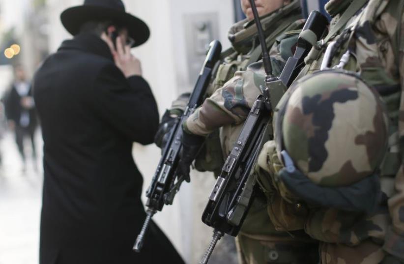 French soldiers patrol the street in a Jewish neighborhood  (photo credit: REUTERS)