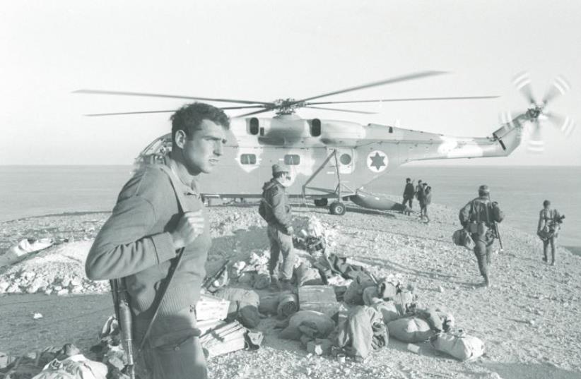 A helicopter waits to fly troops and equipment back after the completion of military action on Egypt’s Shadwan Island in 1970 during the War of Attrition (photo credit: MOSHE MILNER / GPO)