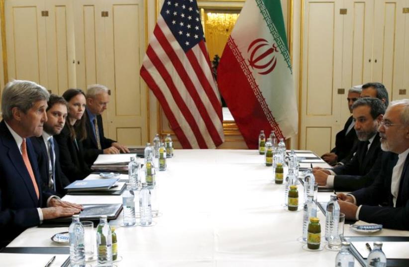 US Secretary of State John Kerry (L) meets with Iranian Foreign Minister Mohammad Javad Zarif- January 16, 2016 (photo credit: REUTERS)