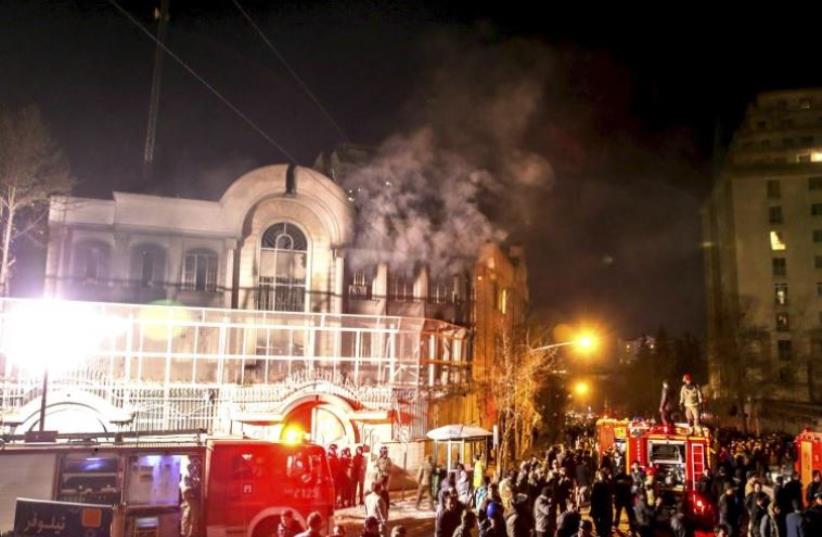 Flames rise from Saudi Arabia's embassy during a demonstration in Tehran January 2, 2016 (photo credit: REUTERS)