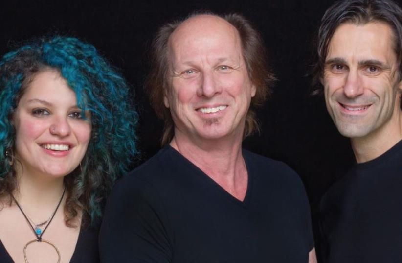 AMERICAN GUITAR whiz Adrian Belew (center) with Julie Slick and Tobias Ralph who make up the Adrian Belew Power Trio (photo credit: Courtesy)