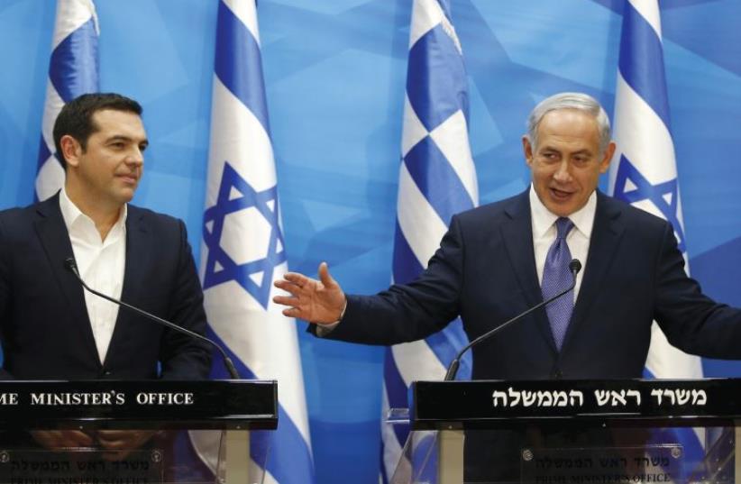 BENJAMIN NETANYAHU gestures as he delivers a joint statement with his Greek counterpart Alexis Tsipras in Jerusalem last November 25.  (photo credit: REUTERS/Ronen Zvulun)
