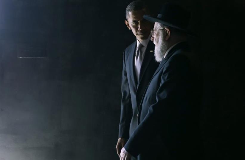US President Barack Obama walks with Rabbi Israel Meir Lau in the Hall of Remembrance during Obama's visit to the Yad Vashem Holocaust Memorial in Jerusalem, March 22, 2013 (photo credit: REUTERS)