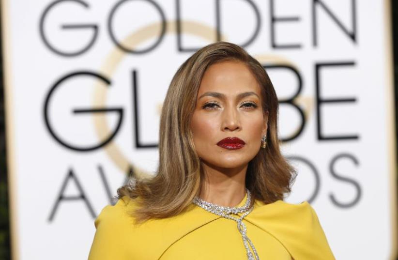 Actress Jennifer Lopez arrives at the 73rd Golden Globe Awards in Beverly Hills, California January 10, 2016.  (photo credit: REUTERS)