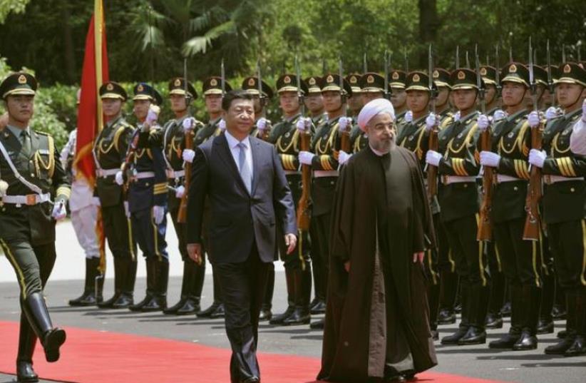 Iranian President Hassan Rouhani (R) and Chinese President Xi Jinping. (photo credit: REUTERS)