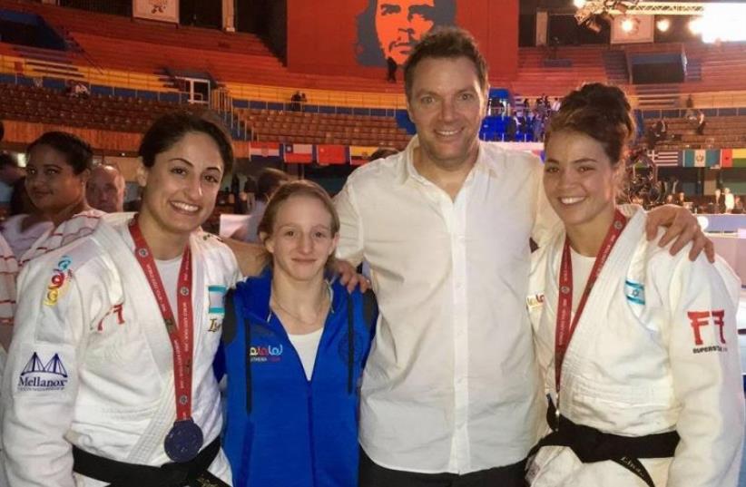 Israeli judokas Yarden Gerbi (L) and Linda Bolder (R) both won gold medals at the Grand Prix of Havana in Cuba on January 23, 2016, while Shira Rishony (2nd L) claimed a silver the previous day. All three are guided by national team coach Shany Hershko (2nd R). (photo credit: ISRAEL JUDO ASSOCIATION/FACEBOOK)