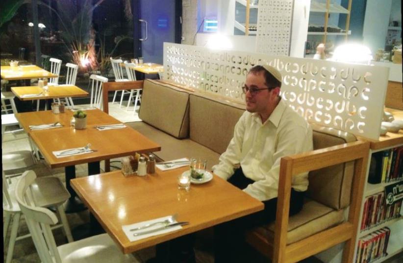 Chananya Weissman in Jerusalem’s Bagel Cafe (photo credit: ORIT ARFA)