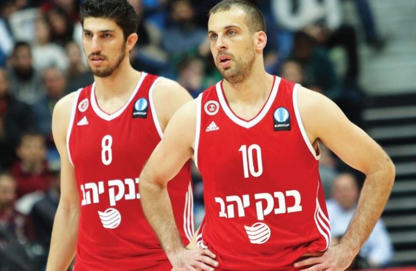 Hapoel Jerusalem guard Yotam Halperin (right) and forward Lior Eliyahu react after their team was eliminated from Eurocup (photo credit: DANNY MARON)