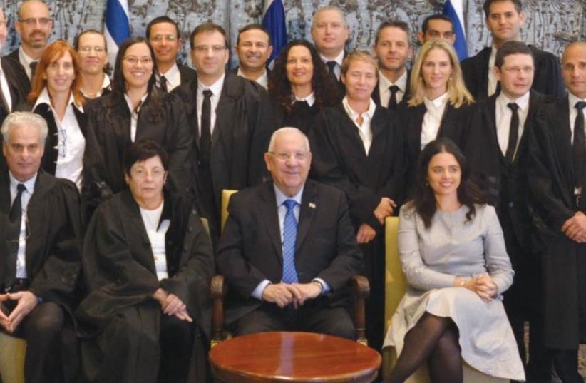 New judges take a group photograph with (bottom row, right to left) Justice Minister Ayelet Shaked, President Reuven Rivlin, Supreme Court President Miriam Naor and National Labor Court President Yigal Plitman (photo credit: Courtesy)