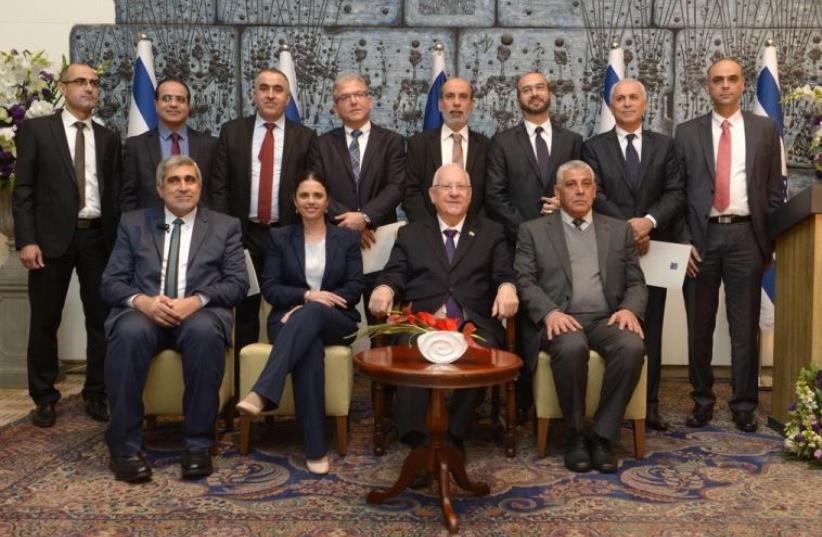 President Reuven Riuvlin (front 2nd right) and Justice Minister Ayelet Shaked (front 2nd leftL) at an appointment ceremony for seven new Qadis to the Shariah courts, Jerusalem, February 9, 2016 (photo credit: Mark Neiman/GPO)