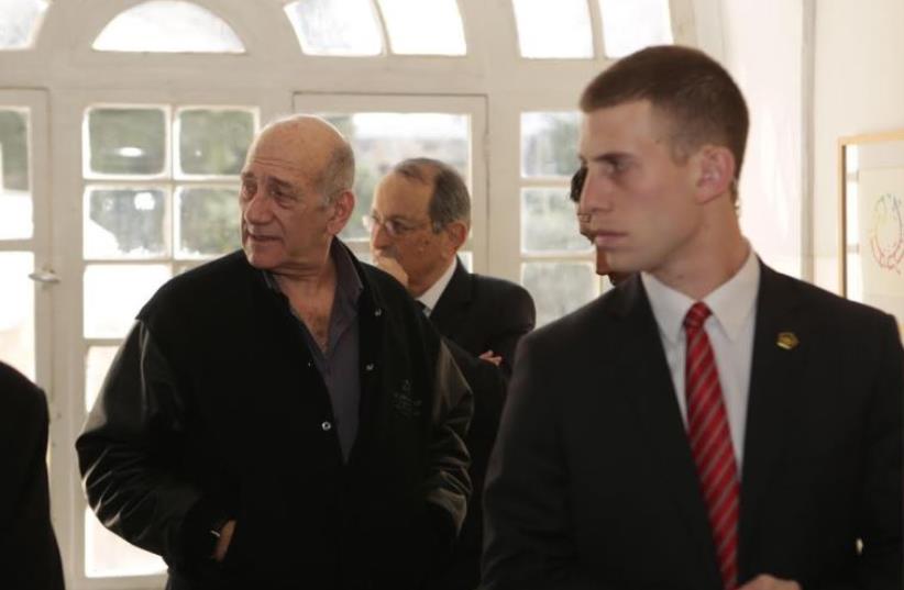 Former prime minister Ehud Olmert at the Jerusalem Magistrate's Court, February 10, 2016 (photo credit: POOL/OLIVIA FITUSSI)