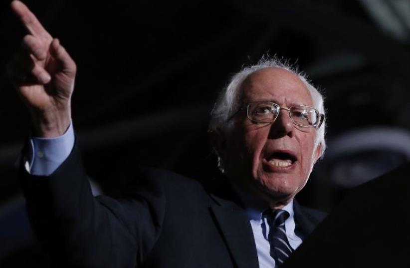 Democratic US presidential candidate Bernie Sanders speaks after winning at his 2016 New Hampshire presidential primary night rally in Concord (photo credit: REUTERS)