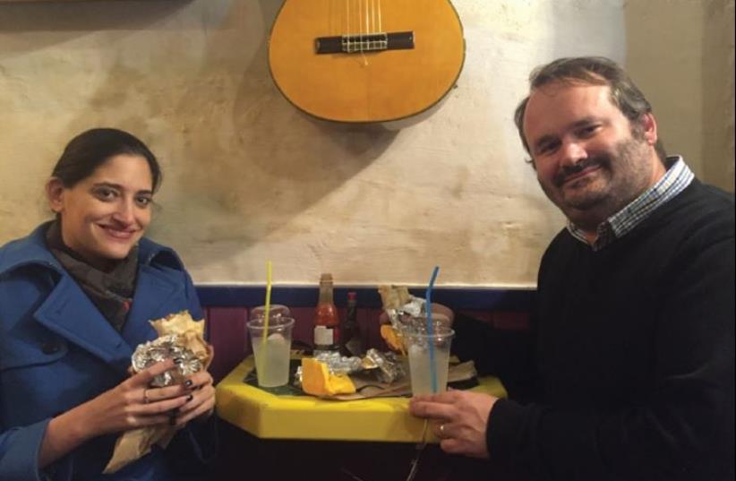 ‘Jerusalem Post’ news editor Noa Amouyal joins Seth Frantzman in biting into burritos (with margaritas thrown in) (photo credit: SETH J. FRANTZMAN)