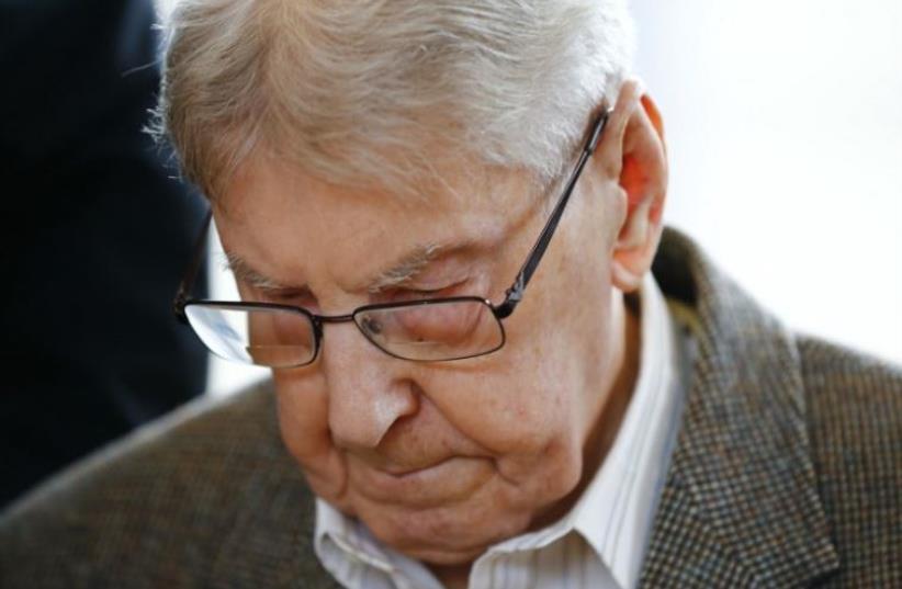 Former Auschwitz guard Reinhold Hanning arrives for his trial at the court in Detmold, western Germany (photo credit: AFP PHOTO)