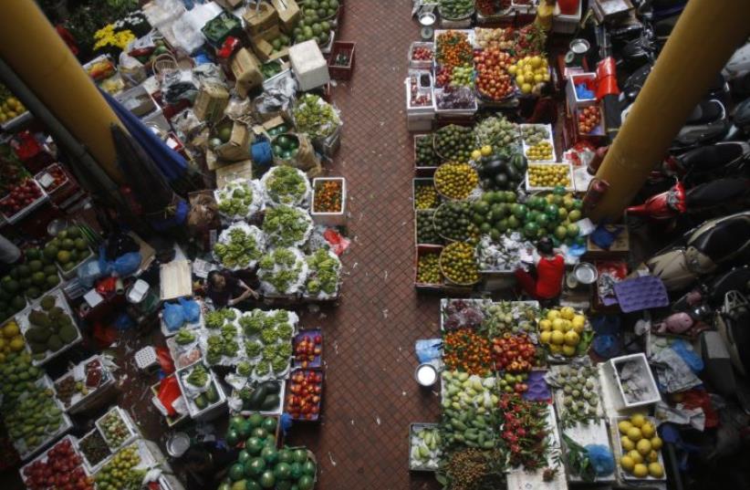 Fruits are displayed for sale at a market in Hanoi, Vietnam (photo credit: REUTERS)