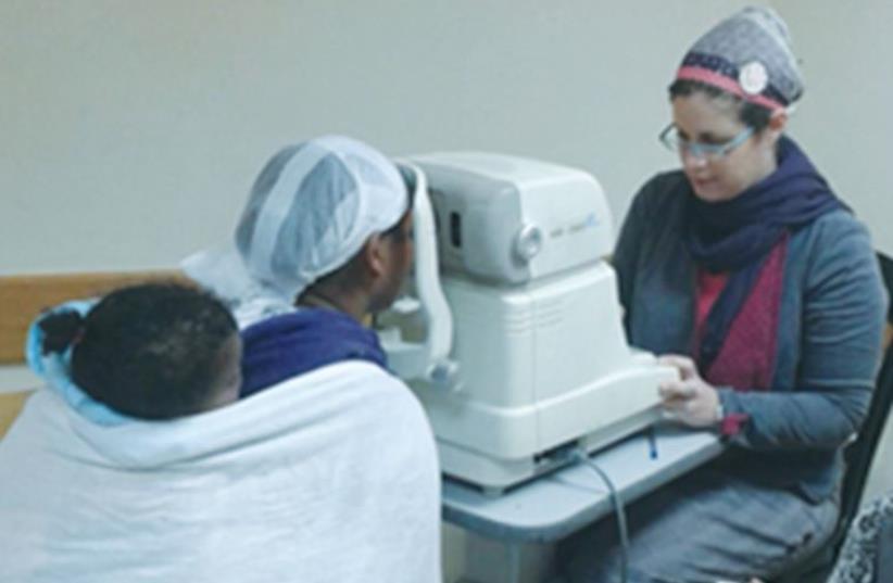 AN ETHIOPIAN WOMAN undergoes a free vision test. (photo credit: HADASSAH ACADEMIC COLLEGE)