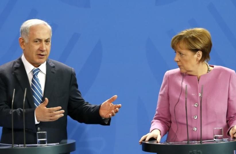 Netanyahu (L) and German Chancellor Angela Merkel address a news conference at the Chancellery in Berlin, Germany, February 16, 2016 (photo credit: REUTERS)