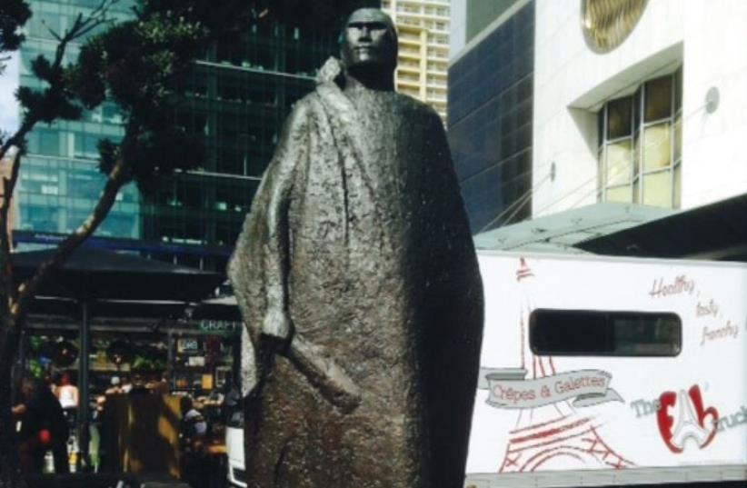 Statue of Maori warrior at Auckland harbor, New Zealand (photo credit: SUSIE WEISS)