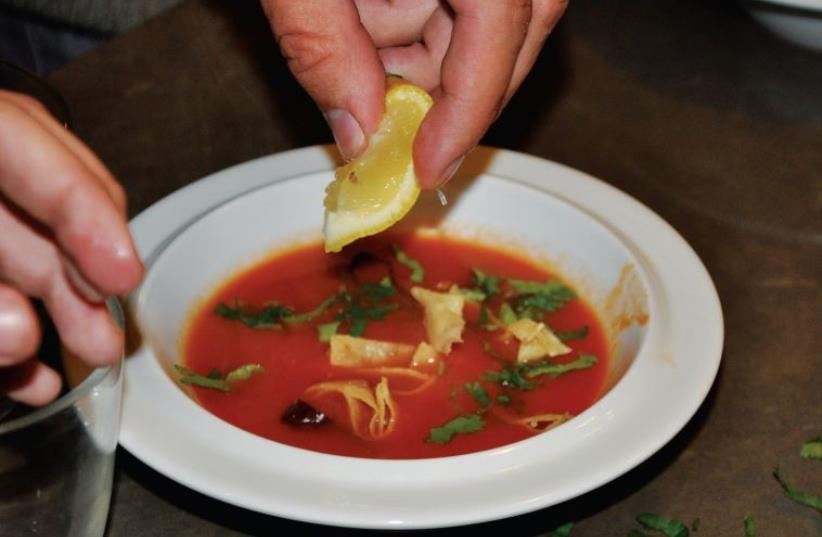 Sopa Azteca – tomato soup garnished with tortilla, avocado, lemon and sliced dried chilies. (photo credit: DEBI LERNER-RUBIN)