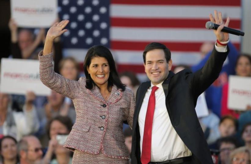 South Carolina Governor Nikki Haley and Marco Rubio react on stage during a campaign event in Chapin (photo credit: REUTERS)