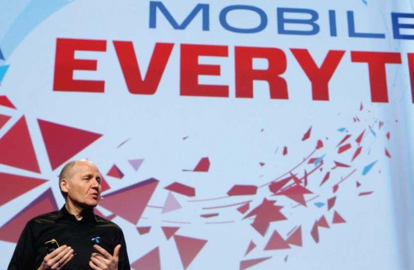 SIGVE BREKKE, president and CEO at Telenor, delivers a keynote speech during the Mobile World Congress in Barcelona, Spain, yesterday. (photo credit: REUTERS)